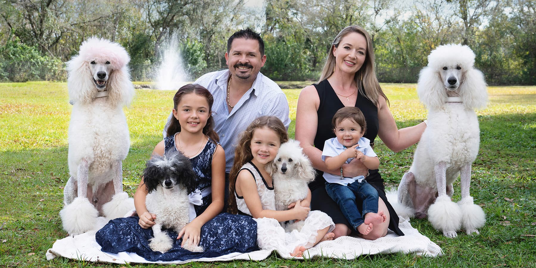 The Pompeyo family on the grounds of AAA Pet Resort